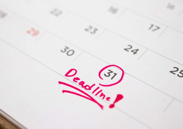 Calendar with an enrollment date circled to avoid Medicare late penalties